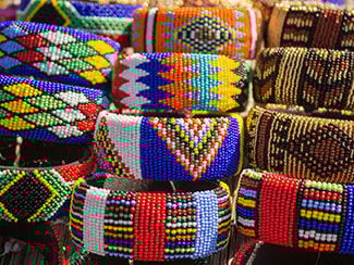 African bright colorful beads bracelets. Local market. Fashion accessories. 