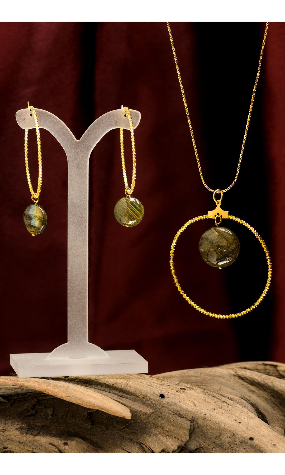 Design Idea S A 2 4 necklace and earring set featuring labradorite gemstone beads and gold-plated components and chain with red fabric background on top of a wood texture