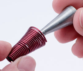Taking the finished product off the mandrel