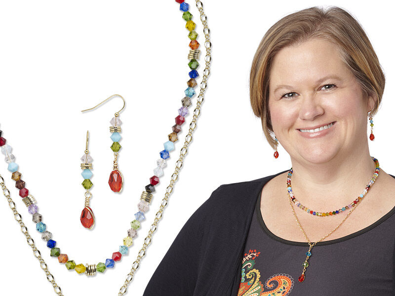 Model wearing a necklace and earrings made with celestial crystal