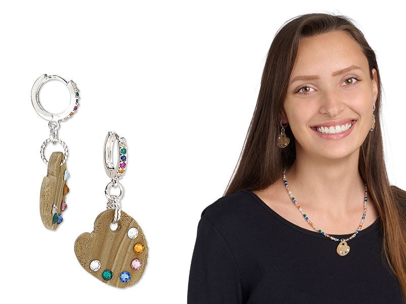 Model wearing earrings that have rhinestones embellished on components