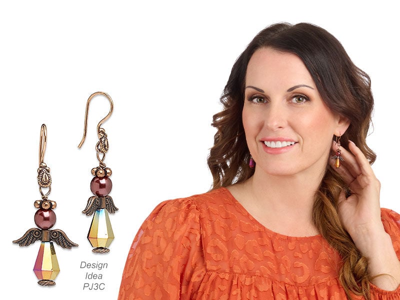 Model wearing earrings made with metal beads
