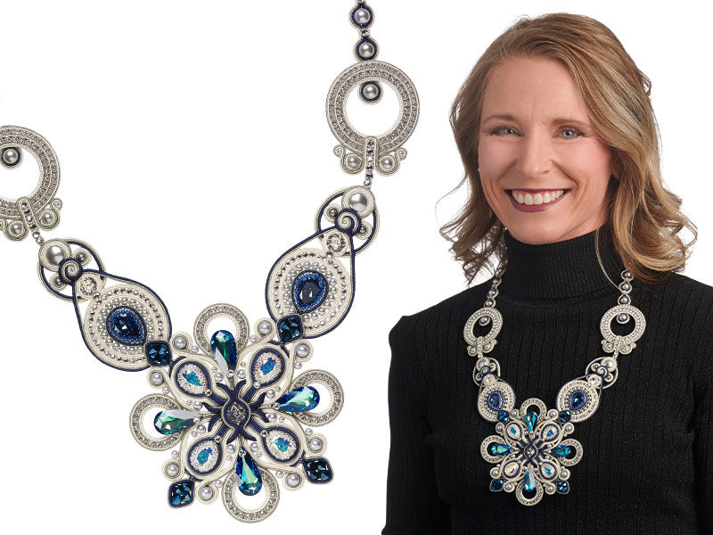 Model wearing a necklace made with fancy stones