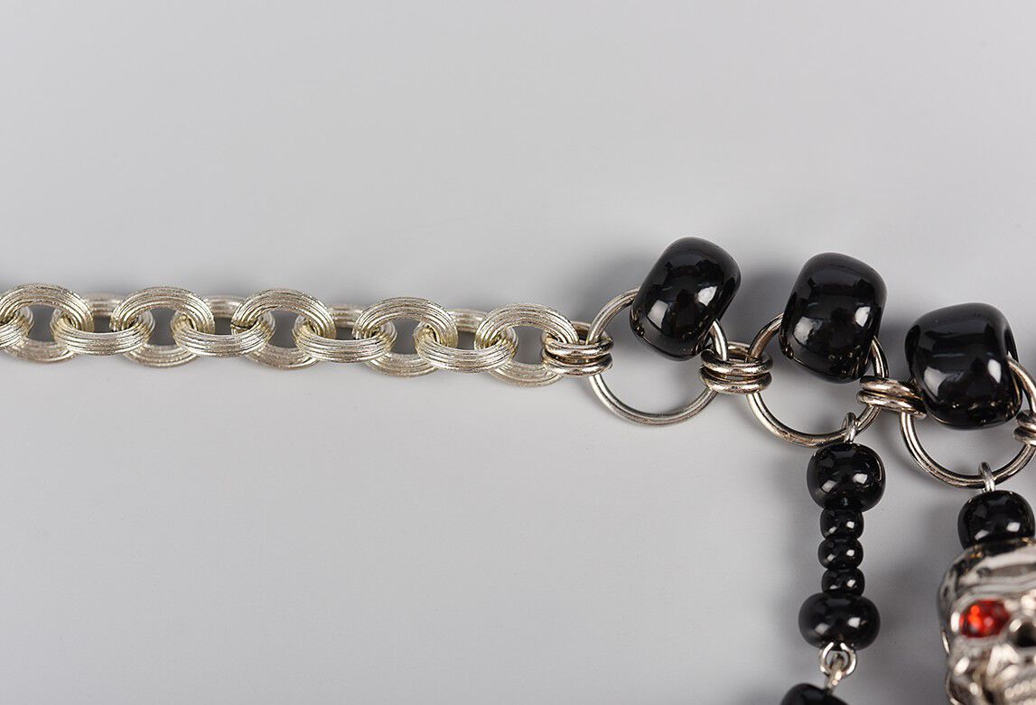 Closeup of chain attaching to jump rings to complete necklace