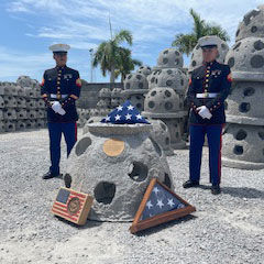 Frank's reef flanked by two marines