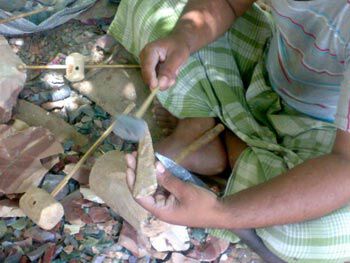 Man knapping stone