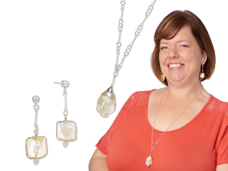 An image of a model wearing a baroque pearl necklace