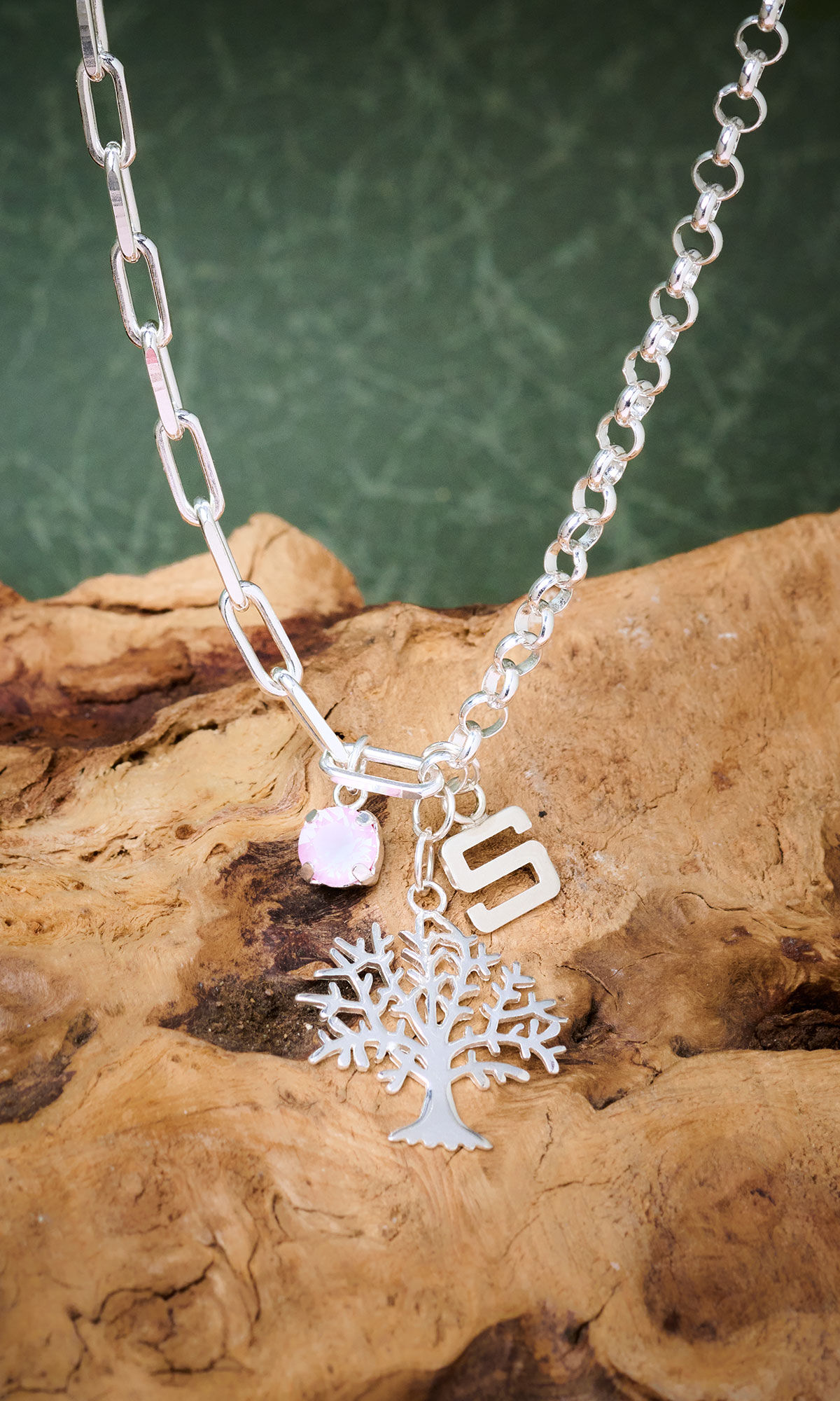 design idea R J 2 H hanging over a stone