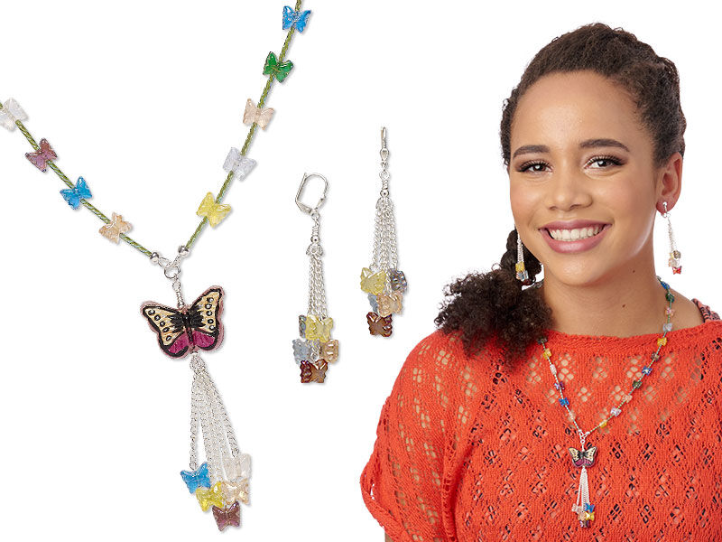 Model wearing a necklace and earrings made with glass beads