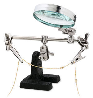Third hand with magnifying glass