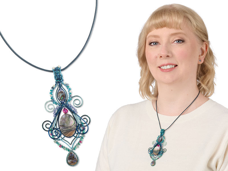 Model wearing a green and red wirewrapped necklace