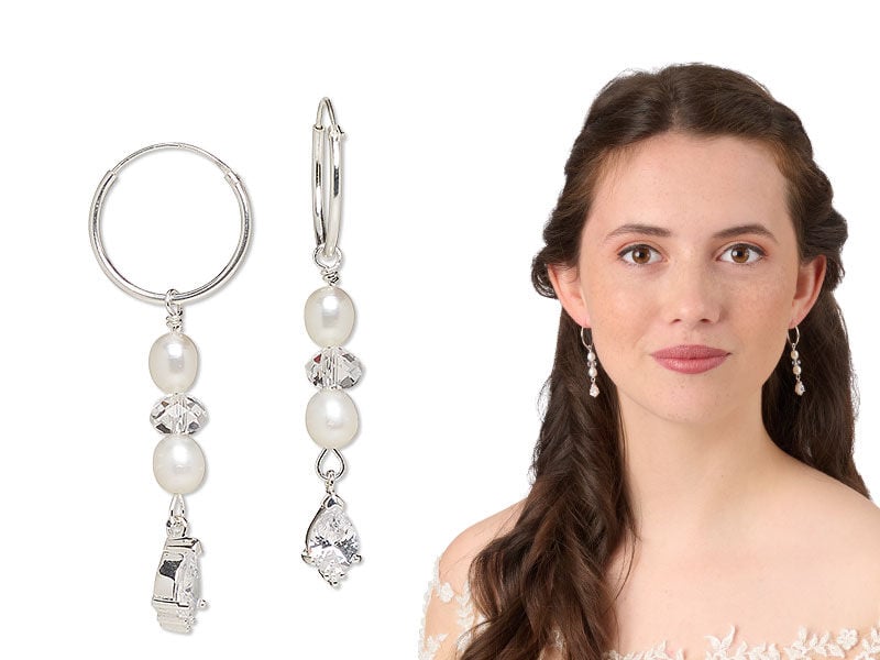 Model wearing earrings with pearls