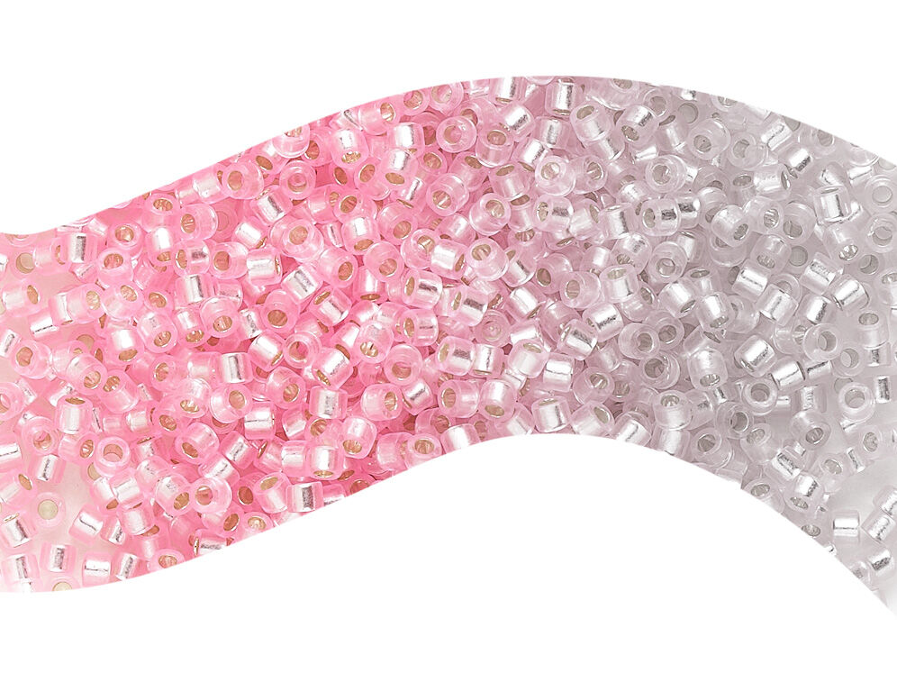A gradient of pink beads fading into white 
