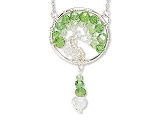 Tree-of-life handcrafted suncatcher, with vivid green crystals and sculptural wirework