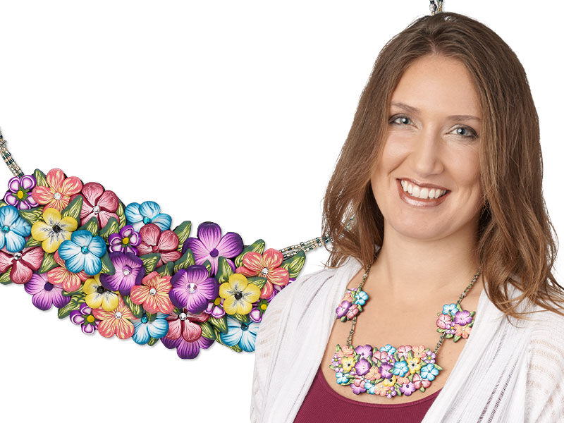 Model wearing a large necklace made with polymer clay