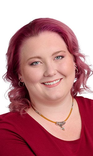 model with red top wearing Design Idea R E 3 J Beaded necklace with a metal tube and honeybee focal