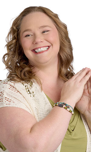 female model in green top wearing Design Idea R E3 N Multi-Strand Bracelet with Hemptique® Cord, Wooden Beads and Paua Shell