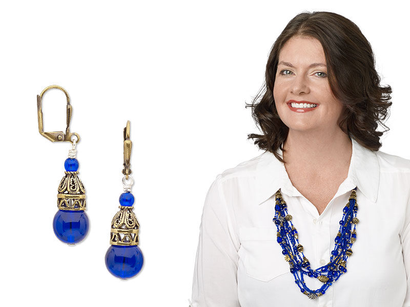 Model wearing a necklace and earrings made with glass beads