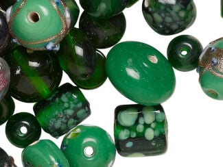 Lampworked beads in various shades of green with light green spatters