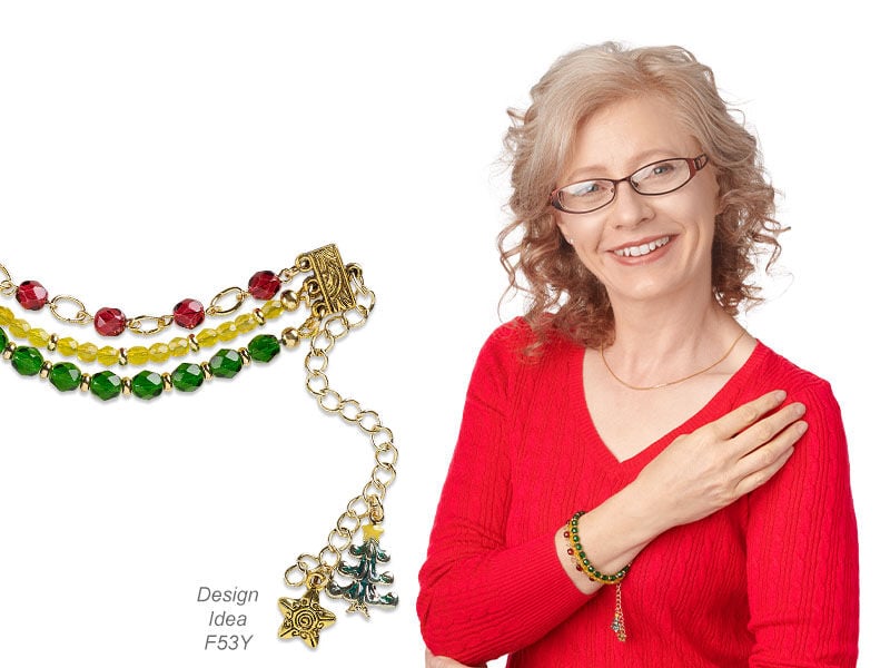 Model wearing a necklace and earrings made with glass beads
