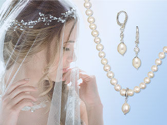Image of pearl necklace and earrings with a bride