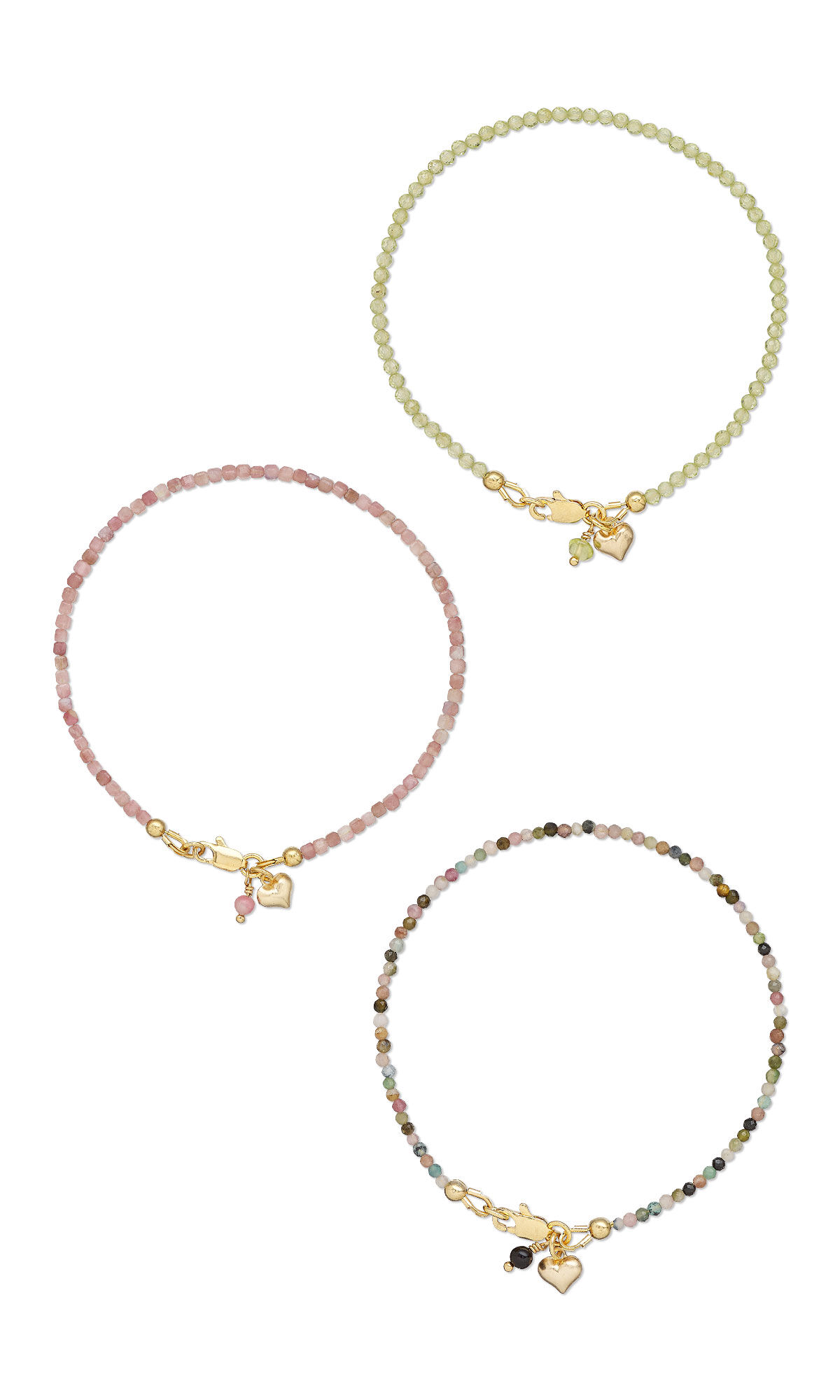 A green bracelet, a pink bracelet, and a multicolored bracelet with gold heart charms.