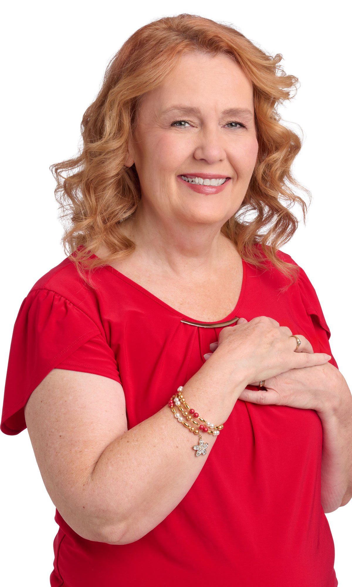 Woman wearing a red shirt and wearing a red, white and gold bracelet