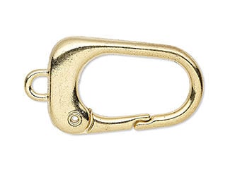 Gold-hued clasp has a loop on the left and a press-in opening on the bottom.
