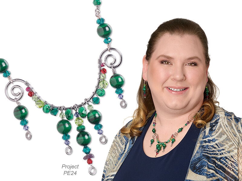 Model wearing jewelry made with gemstones