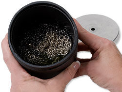 Metal in a tumbling barrel