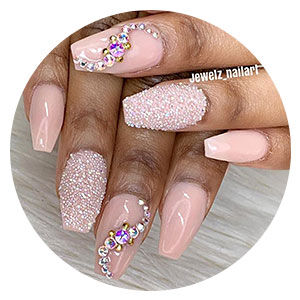 Pink nails with embellishments