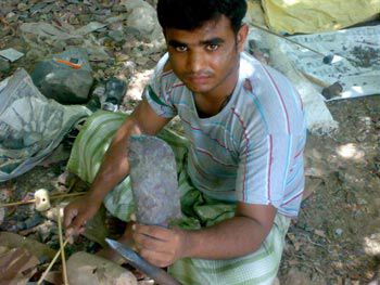 Man holding a knapped knife