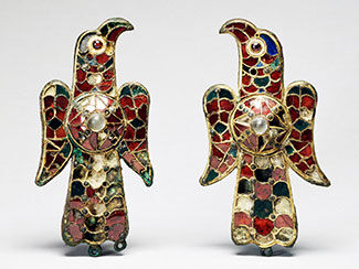 Two red cloisonne eagle brooches