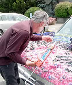 David placing beads on the car.
