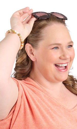 Design Idea R F 2 S on a smiling woman holding sunglasses