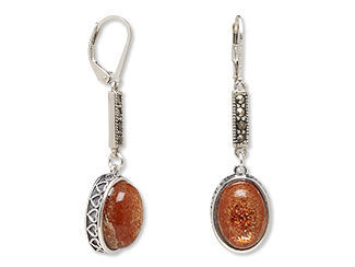 An image of earrings with sunstone cabochons