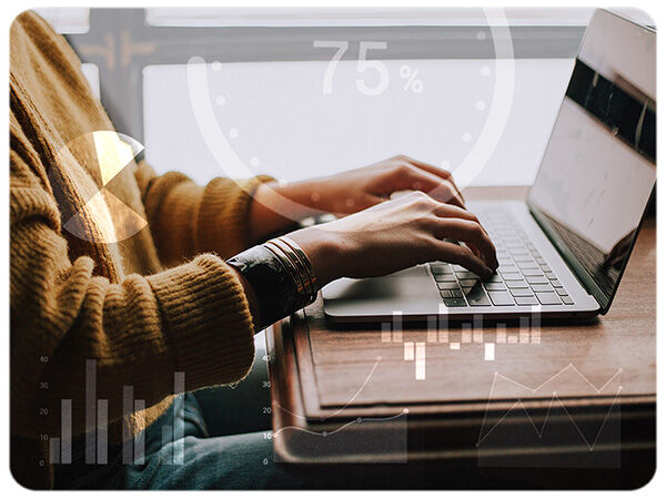 A person typing on a laptop computer