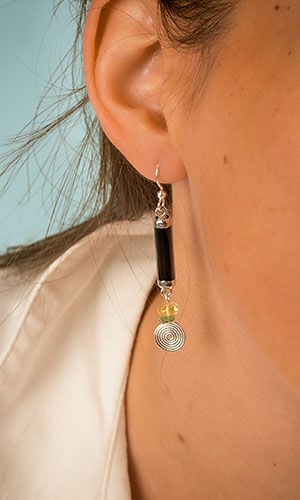 close up photo of model wearing Design Idea S A 2 D gemstone earrings