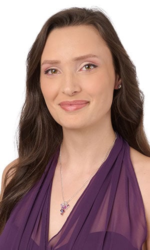 woman in purple dress wearing Design Idea S A 2 T &ndash; Silver chain necklace has a pendant composed of drops of shimmering purple and pink beads and drops.
