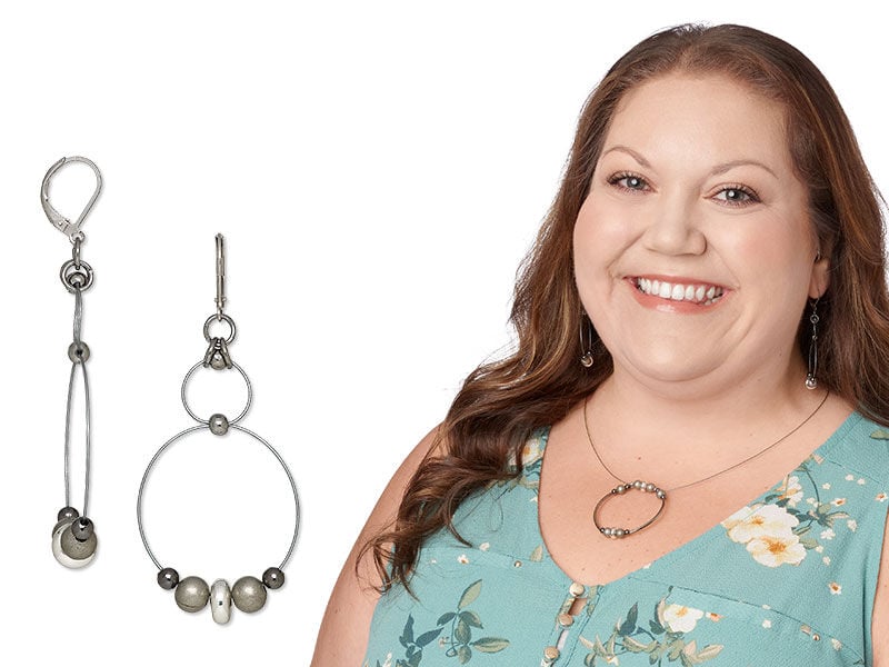 Model wearing earrings made with metal beads