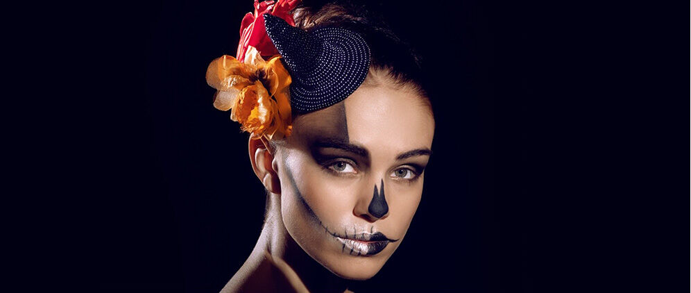 Model wearing tiny black seed-beaded witch’s hat.
