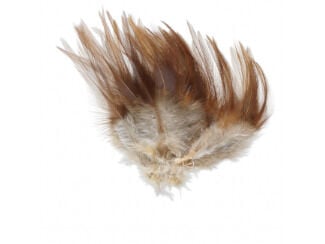 A pile of chicken feathers that are a light neutral color on the bottom and reddish brown near the tips.