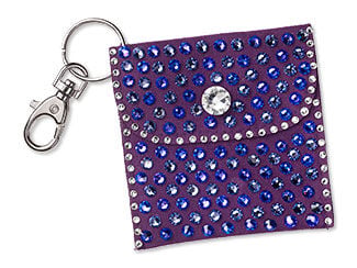 Design Idea S G 2 K - Silver split-ring keychain holds a small purple velveteen pouch with a snap closure embellished with flat back rhinestones in clear and shades of purple.
