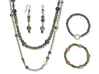 An image of a necklace, bracelet and earring jewelry set made with glass beads and moss agate