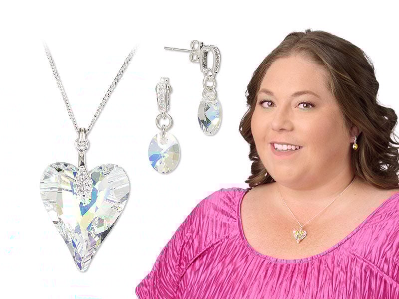 Model wearing a necklace and earrings with clear crystal passions drops