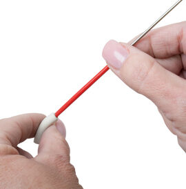 Clay tube being opened