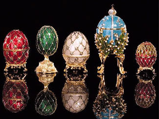 Five Faberge eggs on golden stands