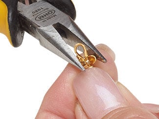 Step 6 showing crimp bead being applied over a crimped end of beading wire