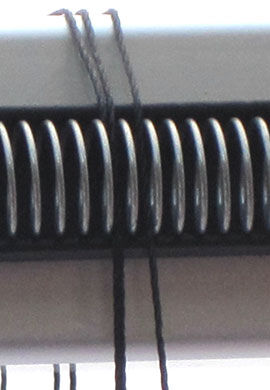Step 14 - The thread then goes over warping coil and into the next dent over