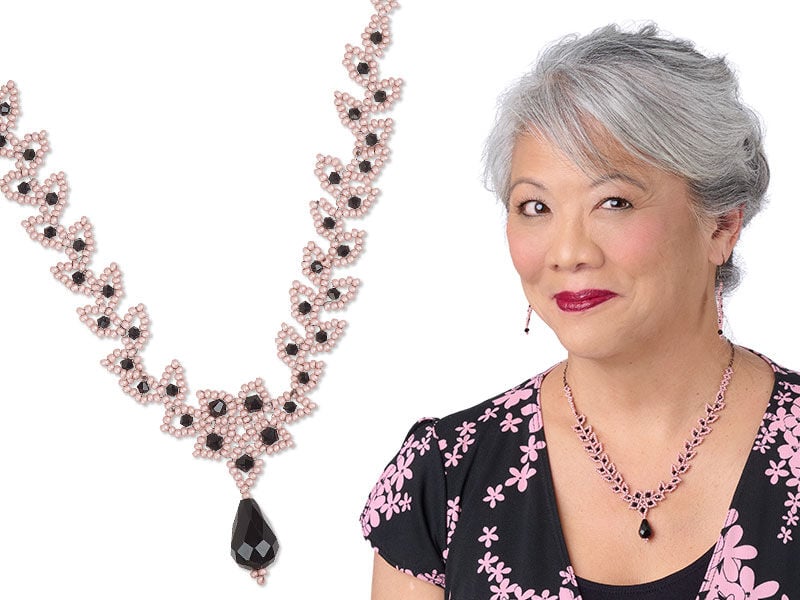 Model wearing stacked bracelets made with Preciosa seed beads
